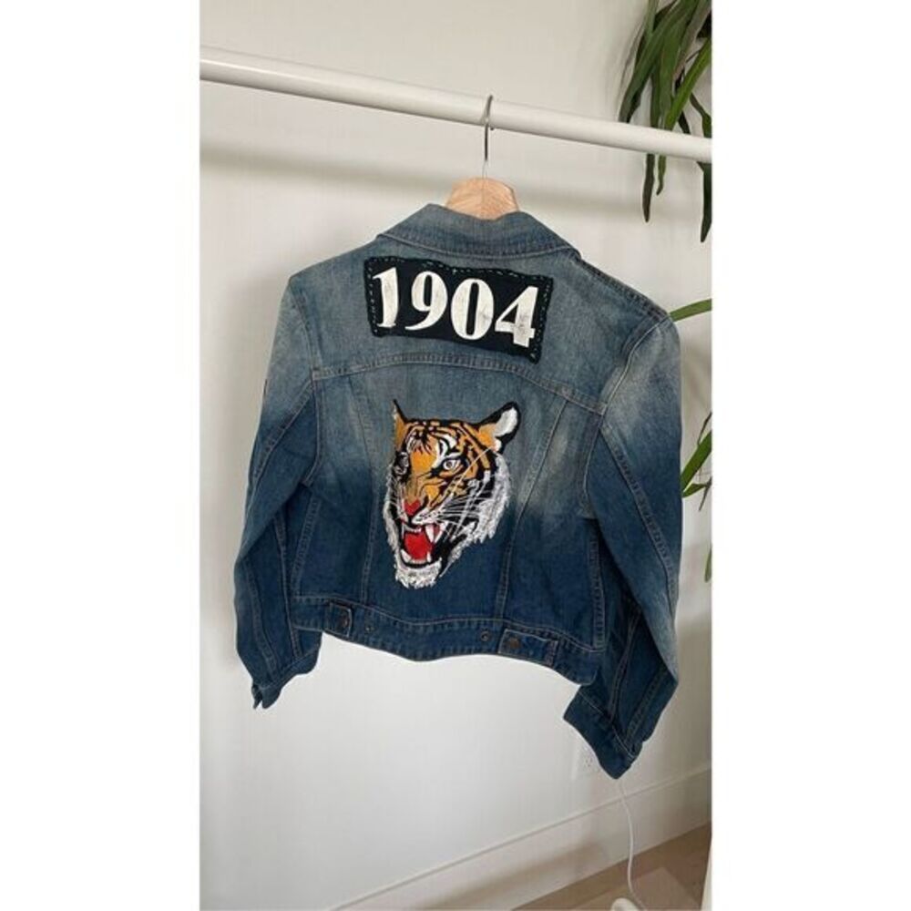 Denim jacket with patches sewn on